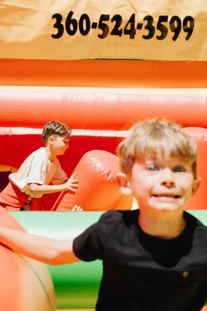 Child playing inside a Benny Bounce House Rental inflatable